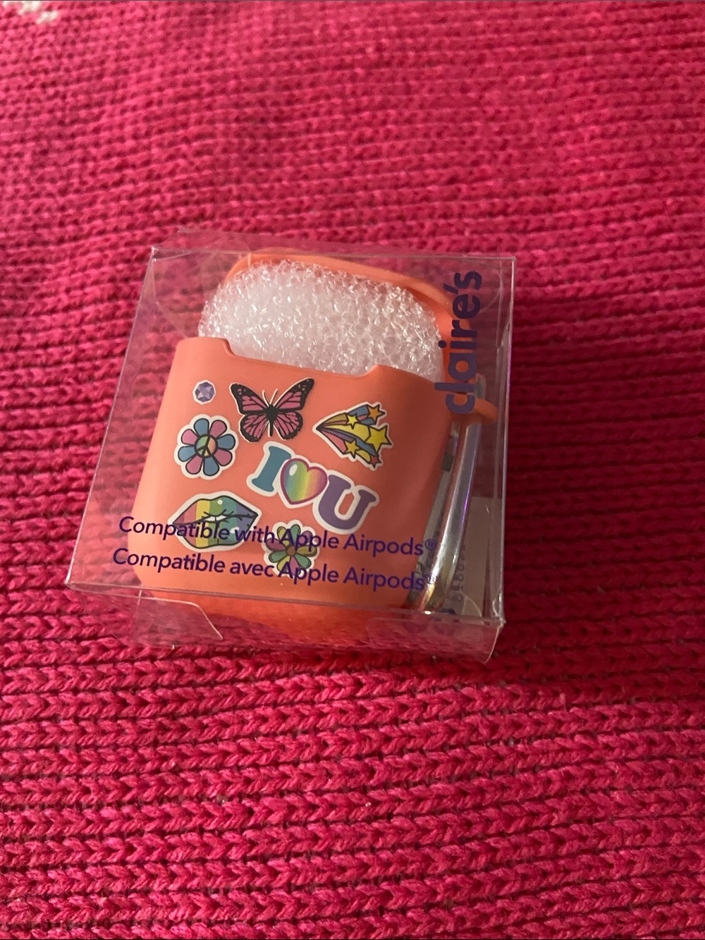 Claire's Orange Sticker-Print Silicone AirPods Case with Carabiner